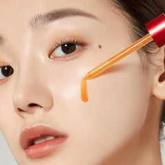 Medicube 21% acid wash-off exfoliant application drops on hand for facial use.