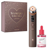Medicube Booster Pro holiday edition package showing a complete gift-set for radiant skin