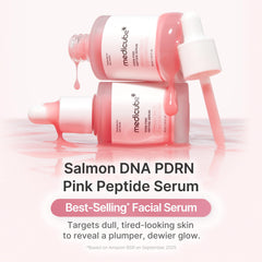 Medicube pink glow serum dropper releasing serum for instant hydration on skin.
