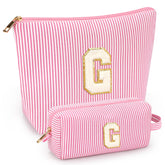 Mibasies 2pcs initial makeup bags laid flat for travel organization.