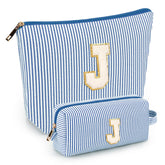 Mibasies initial makeup bag blue front view for organized travel cosmetics
