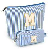 Mibasies initial makeup bags blue front view shows two-pack portability for travel essentials.