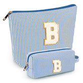 Mibasies initial makeup bags in blue front view, travel-ready cosmetics organizer