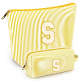 Mibasies initial makeup bags in yellow front view for compact travel organization.