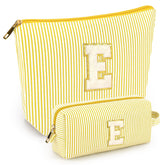 The mibasies initial makeup bags in yellow shown in full view for portable travel storage.