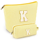 Mibasies two-pack initial makeup bags pair for organized travel and gift-ready presentation