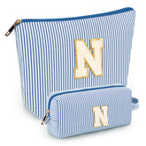 Mibasies two-piece initial makeup bags in blue N front view offer organized travel cosmetics.