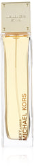 Michael Kors Sexy Amber bottle close-up emphasizing warm amber scent for evening allure
