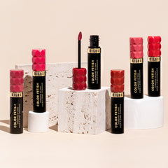 Milani Color Fetish Lip Stain-140 Pink About It on lips showing glossy color with semi-matte transformation.