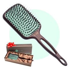 MINT paddle brush with wooden handle for comfortable, eco-friendly detangling.