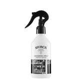 MITCH MVRCK grooming spray bottle being dispensed for flexible hold and natural shine.