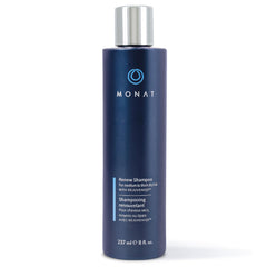 MONAT Renew Shampoo bottle pour showing ultra-hydration for dry hair
