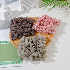 MOSYFEIBI exfoliating mesh shower ball enables gentle body cleansing.