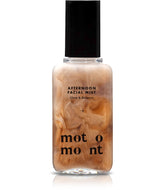 Motomont Milk Tea Dewy Skin Mist bottle close-up showing a hydrating finish.