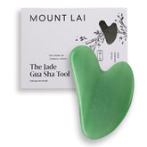 Mount Lai jade gua sha close-up showing cooling genuine jade for mindful facial massage.