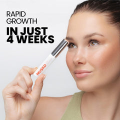 Close-up of MUSKD serum brush delivering nutrients to lash roots for healthier lashes.