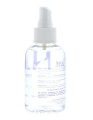 Nairobi Sheer Shine Enhancer hair application demonstrates smooth, frizz control.