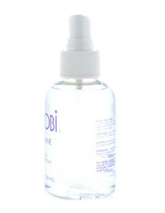 Nairobi Sheer Shine Enhancer packaging shows compact 4 oz size for travel.