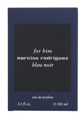 Narciso Rodriguez Bleu Noir bottle on nightstand suggests casual elegance.