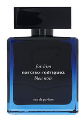 Narciso Rodriguez Bleu Noir spray mist on skin evokes musk and amber warmth.