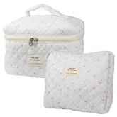 NATINSA cute makeup bag two-piece set with cherry quilted exterior for travel cosmetics organization.