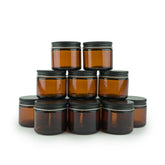 Nature Packaged amber glass 2oz jar side view, travel-friendly beauty container.