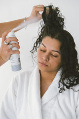 NAVY HAIR CARE Dry Texture Spray misting on dry hair for lift