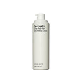 Nécessaire The Body Peel bottle close-up highlighting airless design for purity and efficacy.