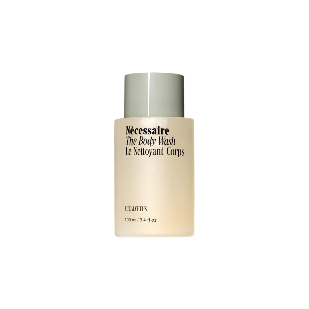 Nécessaire Mini The Body Wash Eucalyptus bottle showing gentle daily cleanse for soft skin.