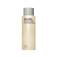 Nécessaire The Body Wash Eucalyptus bottle on a bathroom shelf for a refreshing cleanse.