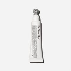 Nécessaire The Lip Balm applied on lips demonstrates a smooth, non-sticky texture for everyday wear.