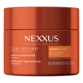 Nexxus Curl Define leave-in bottle close-up showing frizz control and smoother curls.