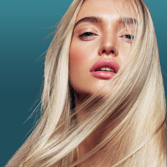 Nexxus Ultralight Smooth Serum application on hair close-up showing smoothing texture