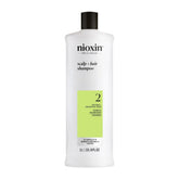 Nioxin System 2 front packaging showing full 33.8 fl oz bottle and branding benefit