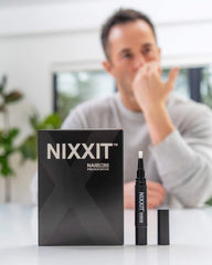 Close-up of NIXXIT Nail Biting Pen brush-application for quick deterrence.