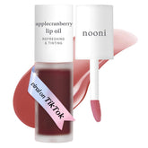 NOONI Applecranberry Lip Oil bottle showcases long-lasting hydration and subtle color.