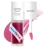 NOONI Applefig lip oil bottle closeup showing glossy finish and hydration.