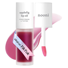 NOONI Applefig lip oil bottle closeup showing glossy finish and hydration.