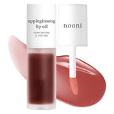 NOONI appleseed oil bottle closeup — hydrating lip care.