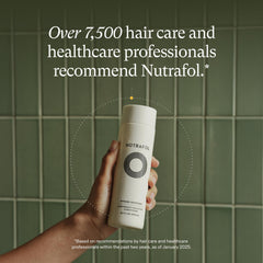 Nutrafol conditioner texture being poured to show lightweight, moisturizing consistency for smooth application