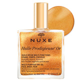 Nuxe Huile Prodigieuse Shimmer bottle pouring for instant glow and hydration.