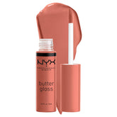NYX Butter Gloss Bit Of Honey bottle-pour reveals peach nude shine.