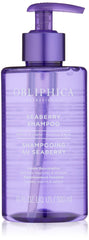 Obliphica Seaberry Shampoo bottle on bathroom shelf supports frizz control and nourishment.
