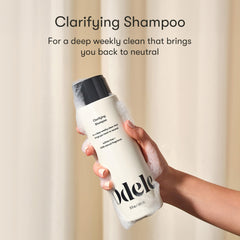 Odele Clarifying Shampoo label highlights color-safe formula for chlorine removal.