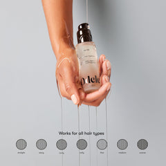 Odele hair oil bottle-closeup highlights nourishing oils for shine and softness.