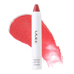 Ogee Linnea tinted lip oil outer packaging with peach glow on the go