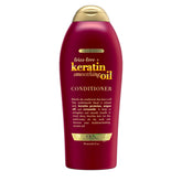 OGX Frizz-Free Keratin Smoothing Oil Conditioner bottle shows frizz control and shine