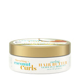 OGX Quenching Coconut Curls Butter bottle pour for detangling and curl definition.