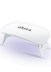 ohora Care LED lamp front view demonstrates compact, on-the-go gel nail curing.