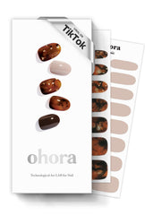 ohora semi-cured gel nail strips N Brown Sugar closeup for a glossy marble-like manicure.